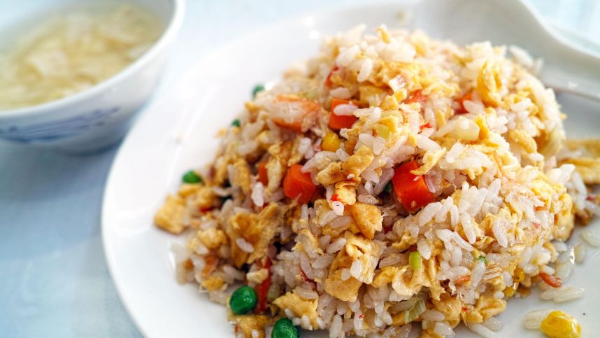 Egg and vegetable fried rice served on a plate